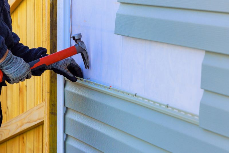 Red Vinyl Siding Installation